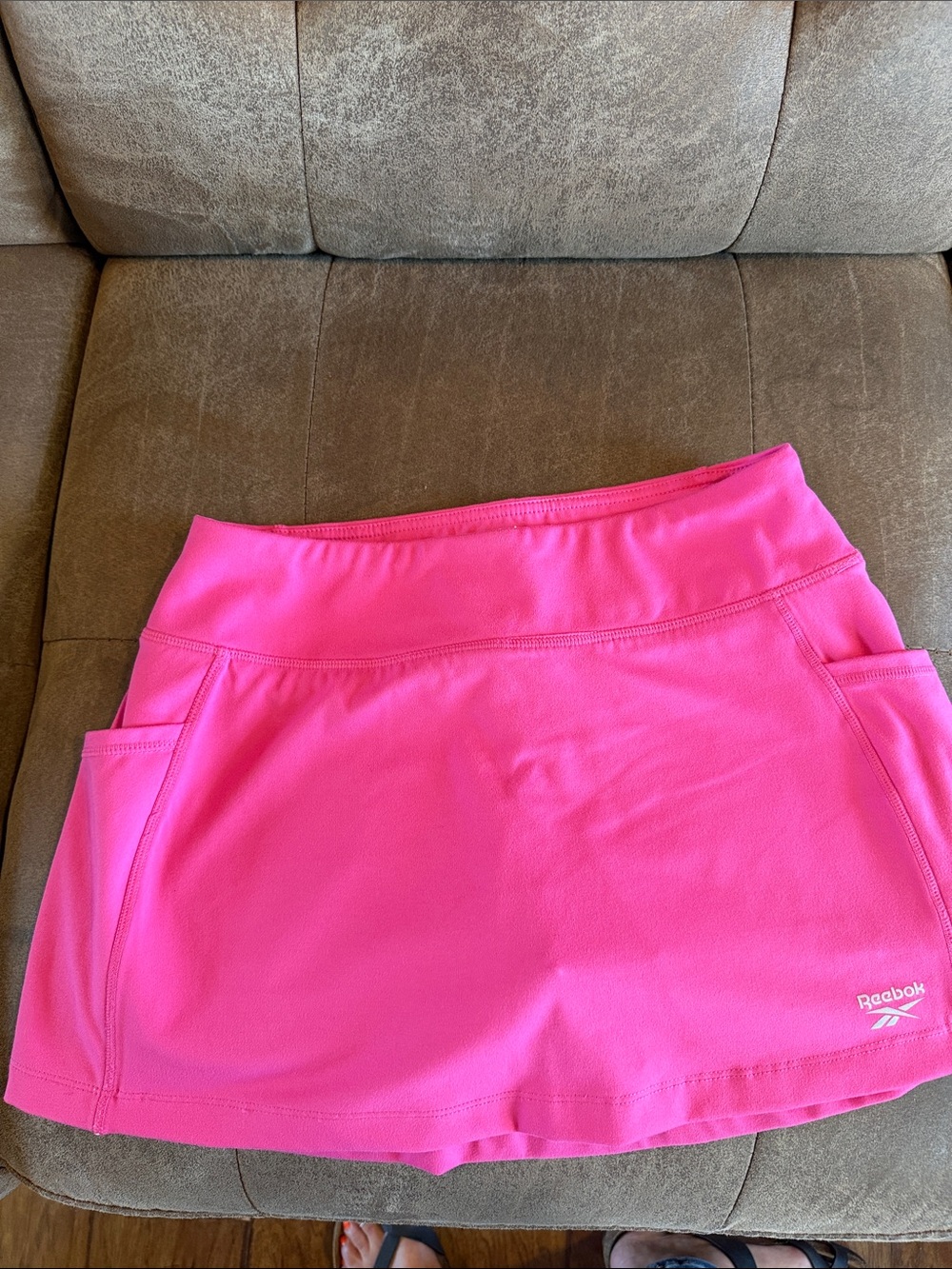 Reebok Women's Bright Pink Athletic Skort with Side Pockets.